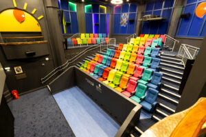 The inside of Birmingham Children's Hospital MEdiCinema with rows of brightly coloured chairs
