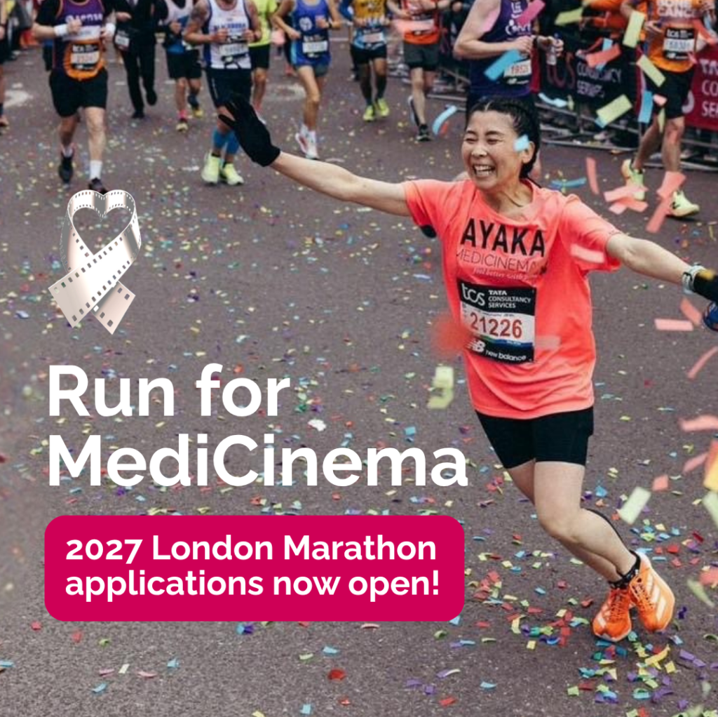 Woman in a bright pink MediCinema t-shirt celebrates finishing the London Marathon