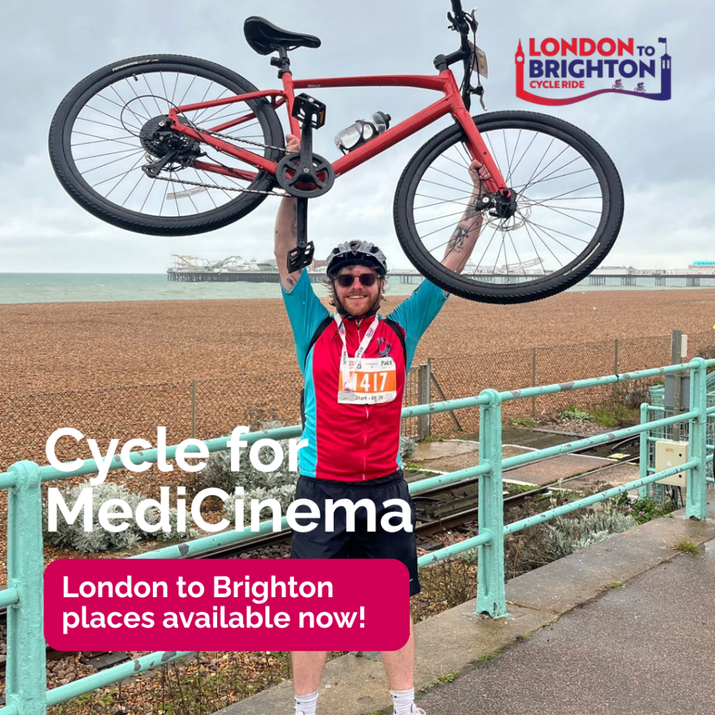 cyclist holds bike above his head whilst standing infront of Brighton beach. Text reads cycle for medicinema London to brighton places now available